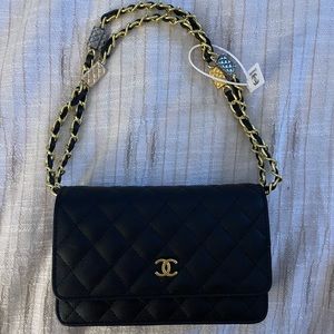 Small Black Chanel Classic Handbag with gold accents
